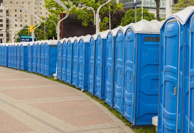 a row of portable restrooms set up for a special event, providing guests with a comfortable and sanitary option in Chanhassen, MN